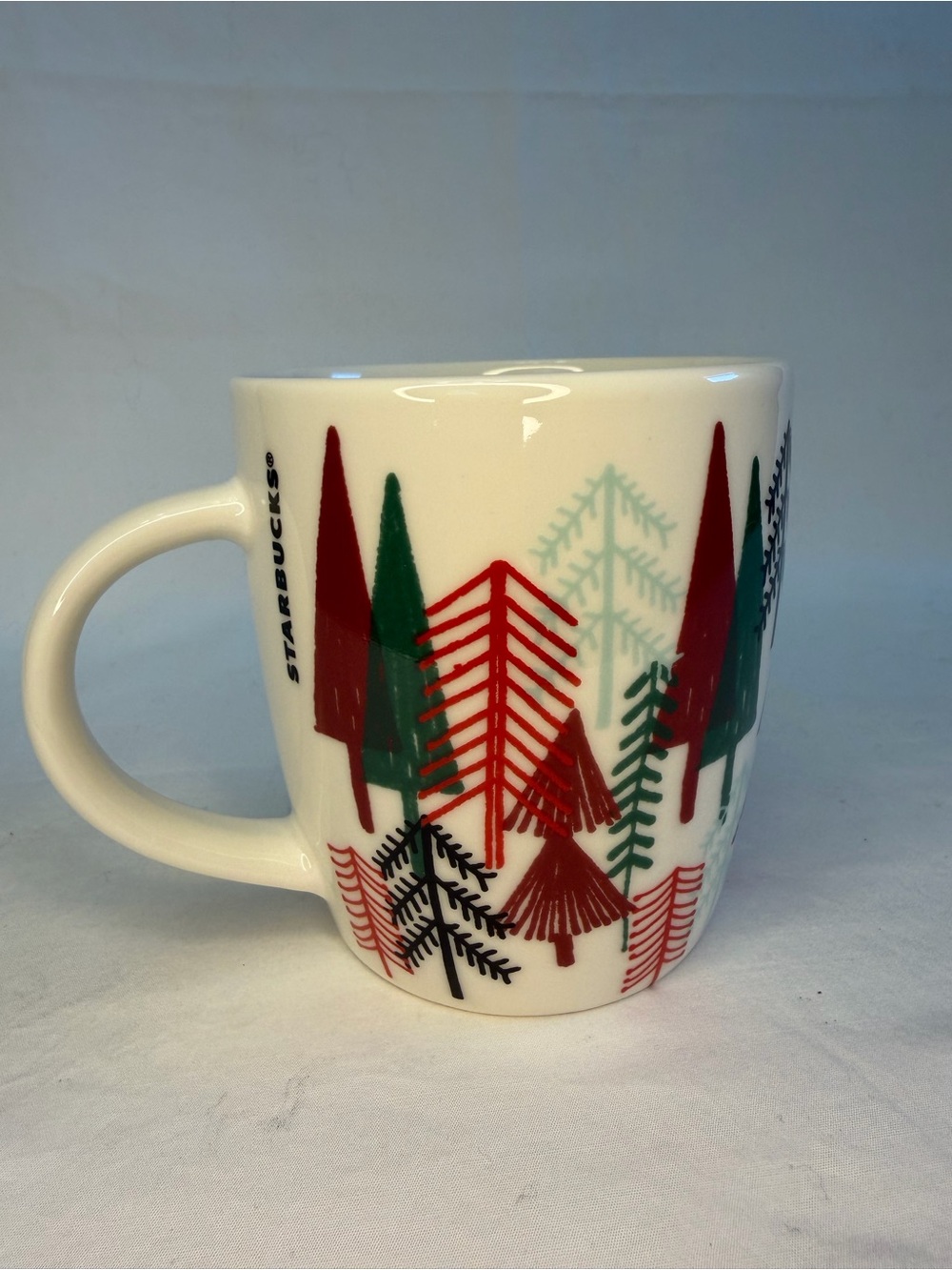 Starbucks Christmas Holiday pine tree mug featuring a festive forest design.